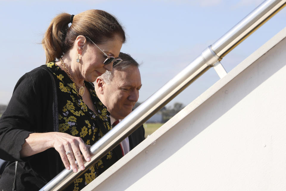 The Pompeos board their plane to depart Sydney International Airport in August 2019.