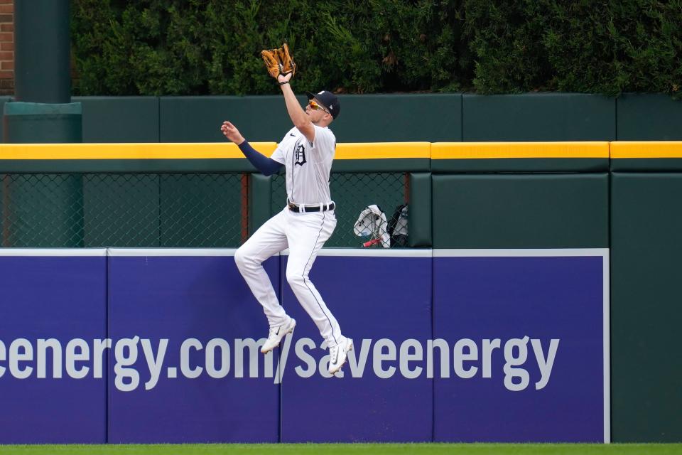 Detroit Tigers center fielder Parker Meadows catches a Kansas City Royals' Nelson Velazquez fly ball at the outfield wall for the final out in the ninth inning of a baseball game that was suspended Wednesday night because of rain, Thursday, Sept. 28, 2023, in Detroit.