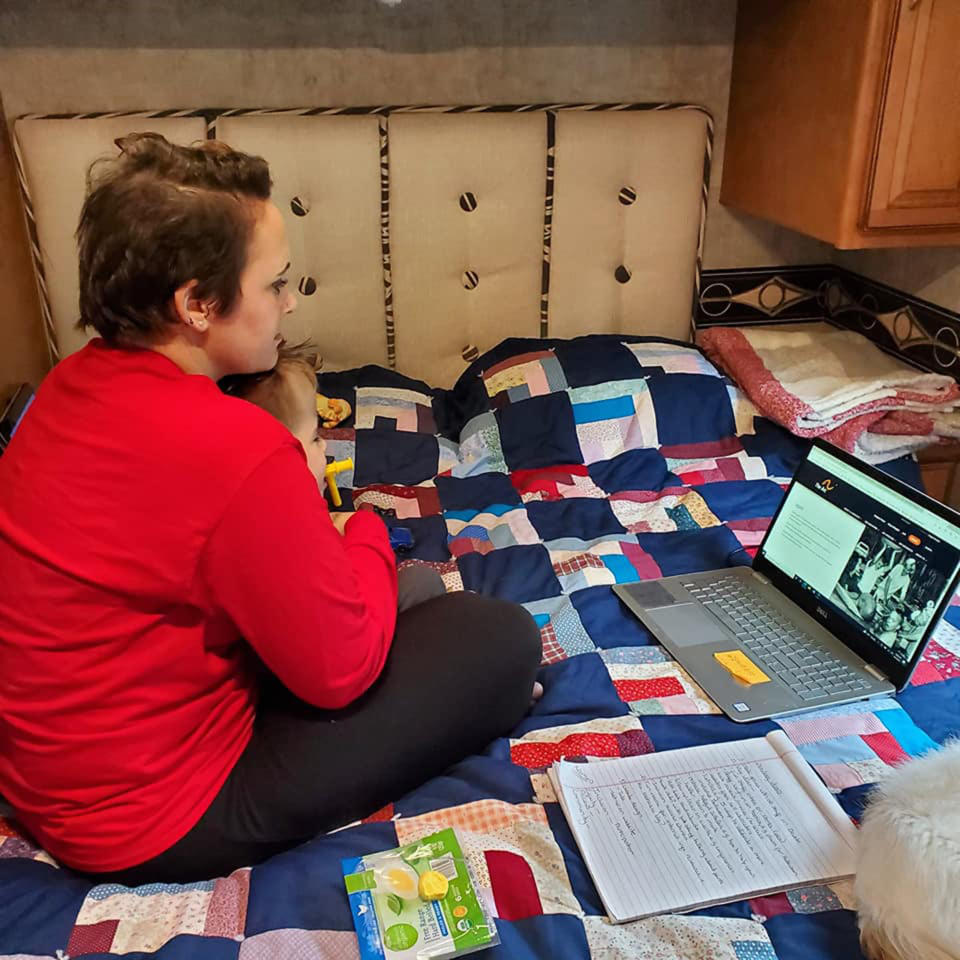 Whitney Stohr finds time to work during Malachi's first camping trip. (Courtesy Whitney Stohr)