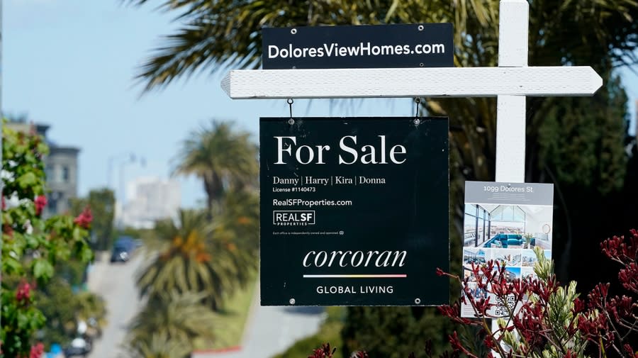 A For Sale sign hangs in front of a property April 18 in San Francisco. (AP Photo/Jeff Chiu)