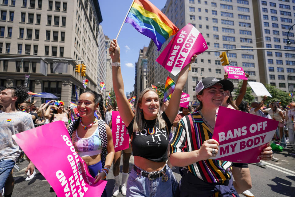 FILE - Revelers with Planned Parenthood march down Fifth Avenue during the annual NYC Pride March, on June 26, 2022, in New York. Organizers of Pride festivals and parades in conservative states are under increasing pressure to censor their events or ban drag performances. That's making it challenging to hold events that celebrate lesbian, gay, bisexual, transgender, and queer identity without running afoul of the laws. (AP Photo/Mary Altaffer, File)