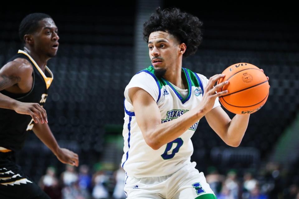 Texas A&M-Corpus Christi's Trevian Tennyson (0) handles a ball in an NCAA Division I basketball game against Texas Lutheran at the American Bank Center on Wednesday, Dec. 7, 2022 in Corpus Christi, Texas. The Islanders won 100-63.