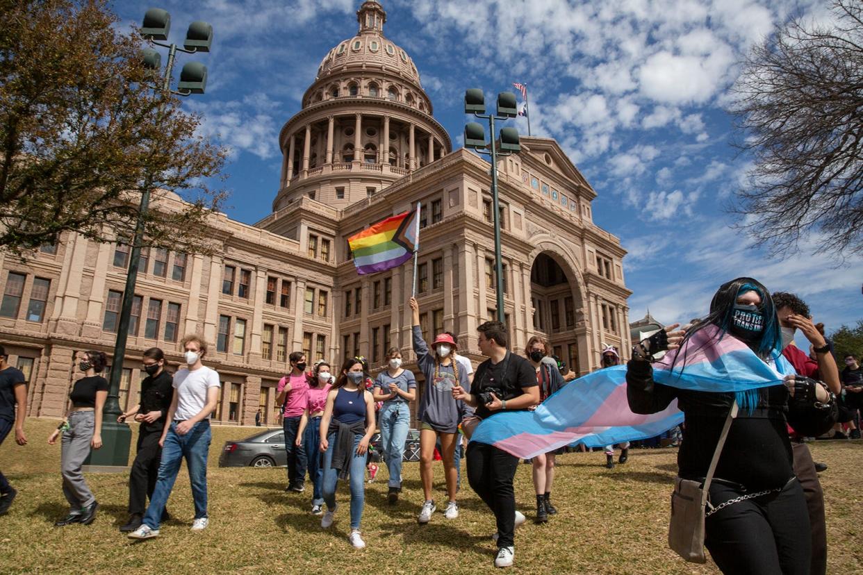 Protesters rally in support of transgender youths outside the Capitol last March. Gov. Greg Abbott and Attorney General Ken Paxton directed the Department of Family and Protective Services to investigate cases of transgender children receiving certain gender-affirming services as child abuse.
