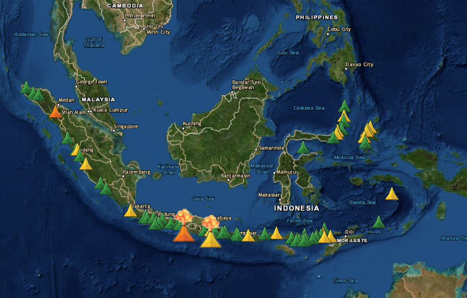 <span class="caption">Active volcanoes monitored by the Indonesian Center for Volcanology and Geological Hazard Mitigation (CVGHM). Curent eruptive activity is noted by the erupting volcano symbols at Mt Merapi (orange) and Mt Semeru (yellow) in Java.</span>
