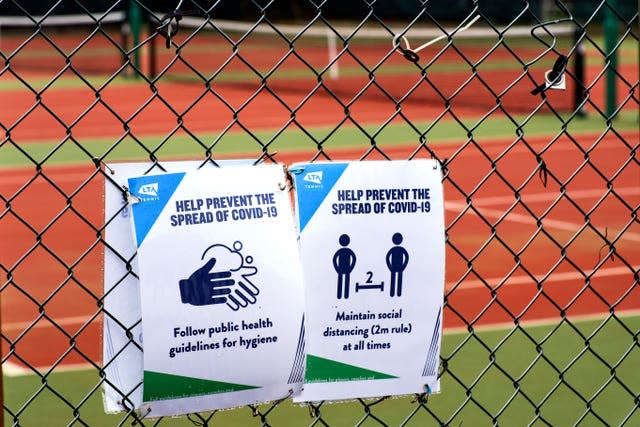 Covid signage to help prevent the spread of the virus at Wycombe House Tennis Club in Isleworth, London (John Walton/PA)