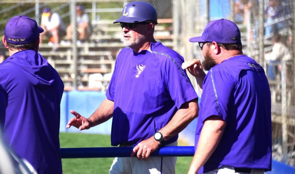 Livingston High School baseball coach Matt Winton chats with his assistant coaches during a Wolves game on Tuesday, April 2, 2024 at Atwater’s Memorial Ballpark. Winton has coached his alma mater for 31 seasons.