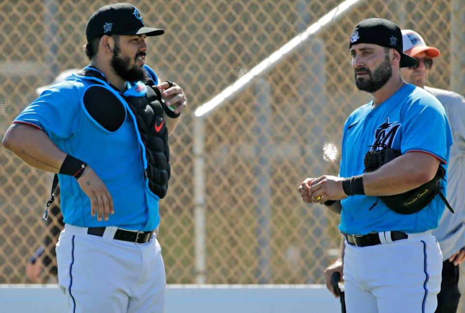 Miami Marlins catcher Jorge Alfaro (38) talks with catcher Francisco Cervelli (29) during the first full-squad spring training workout at Roger Dean Stadium on Monday, February 17, 2020 in Jupiter, FL.