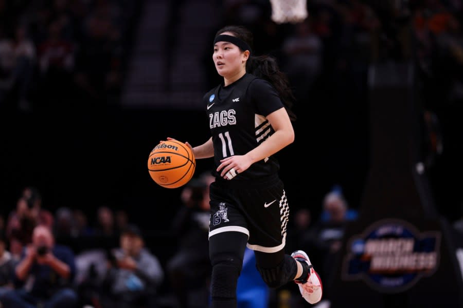 Gonzaga guard Kayleigh Truong (11) dribbles the ball during the first half of a Sweet 16 college basketball game against Texas in the women’s NCAA Tournament, Friday, March 29, 2024, in Portland, Ore. (AP Photo/Howard Lao)