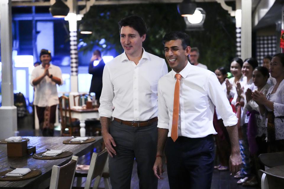 Canada's Prime Minister Justin Trudeau, left, and British Prime Minister Rishi Sunak walk during a meeting at the Art Cafe Bumbu Bali in Bali, Indonesia, on Nov. 14, 2022. President Joe Biden and other leaders of the Group of 20 leading economies will meet in Bali, a tropical island in Indonesia, this week. The gathering is the first G-20 summit since before the pandemic to include face-to-face talks between the leaders. (Sean Kilpatrick/The Canadian Press via AP)