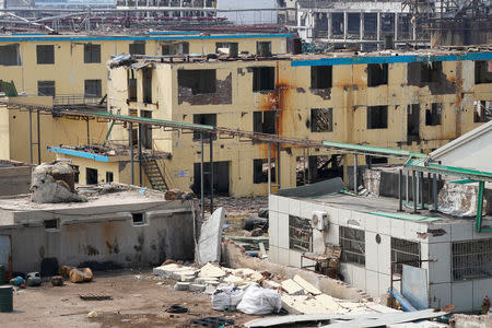 Damaged buildings are seen on the site following an explosion at a pesticide plant owned by Tianjiayi Chemical, in Xiangshui county, Yancheng, Jiangsu province, China March 23, 2019. REUTERS/Aly Song