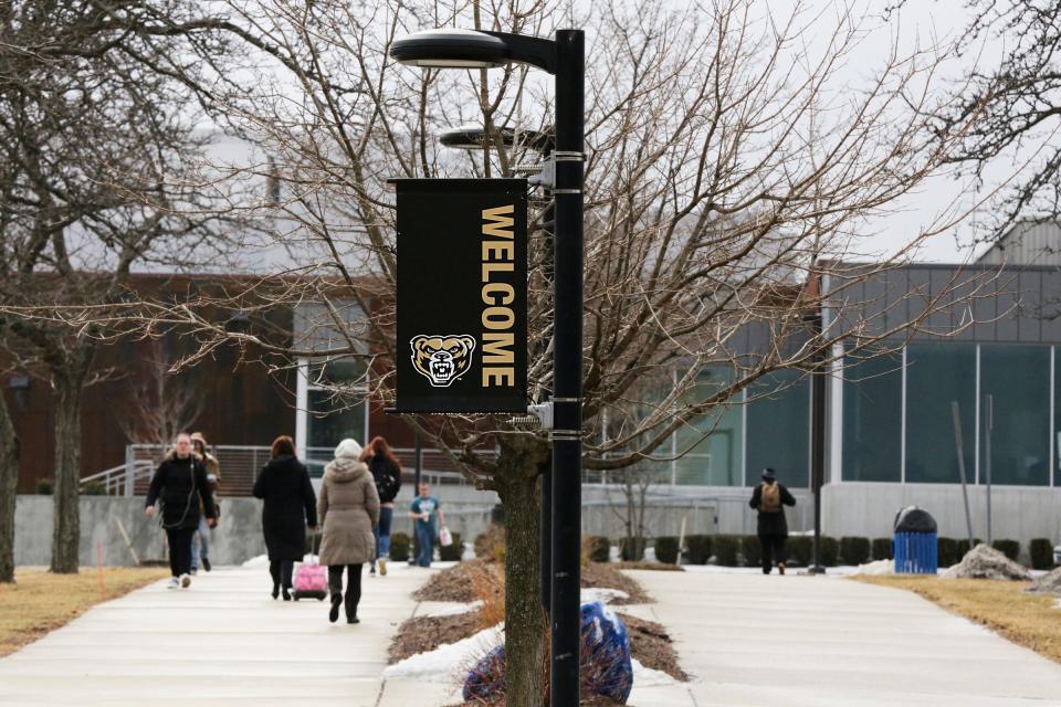 Students walk on campus towards the Oakland Center at Oakland University in Rochester on Wednesday, March 13, 2019. 