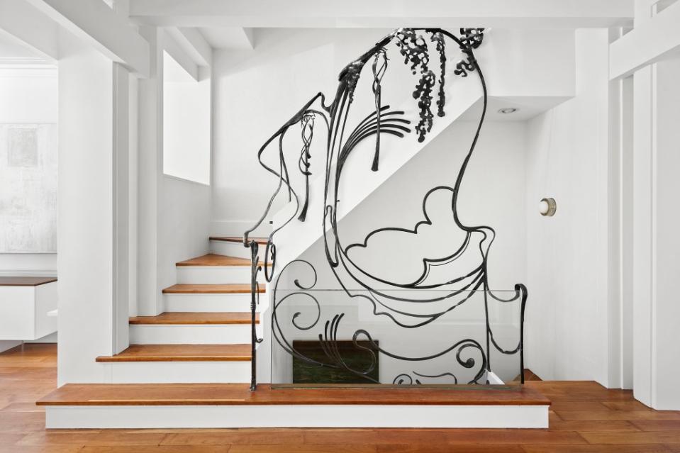A custom metal banister that spans all five floors of No. 159. Vandenberg, The Townhouse Experts