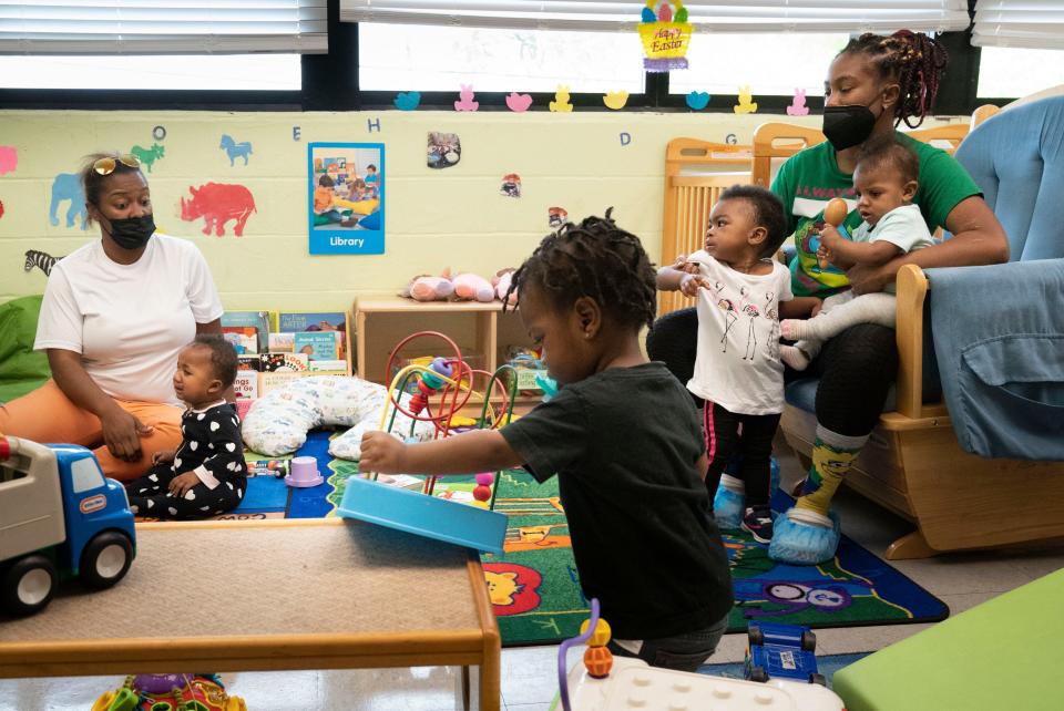 Latasha Watkins and Tiffany Gooch care for toddlers at the Eighteenth Avenue Family Enrichment Center on April 21, 2022, in Nashville. The city has a shortage of high-quality, affordable child care development centers.