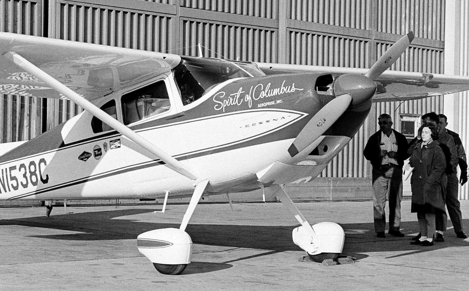 FILE - This photo made March 19, 1964 in Columbus, Ohio, shows Jerrie Mock, beginning her around-the-world flight. Mock was meeting her crew for a final check of the Spirit of Columbus. Fifty years ago Mock became the first woman to make a solo flight around the world. (AP Photo/Gene Smith)