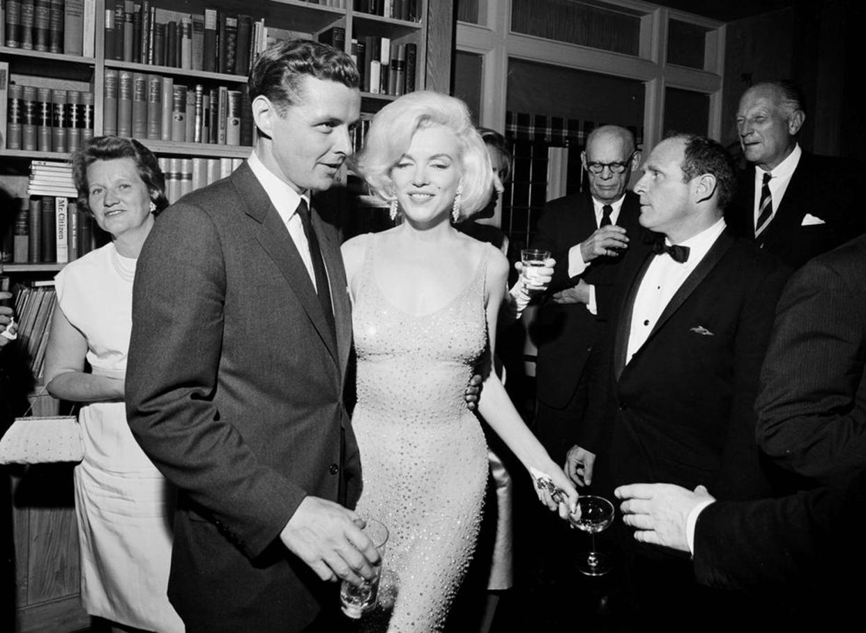 Marilyn Monroe wears the iconic gown that she wore while singing “Happy Birthday” to President John F. Kennedy at Madison Square Garden, during a reception in New York City. (Cecil Stoughton/White House Photographs, John F. Kennedy Presidential Library and Museum via AP)