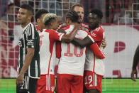 Bayern's Leroy Sane, centre, celebrates after scoring his side's opening goal during the Champions League group A soccer match between Bayern Munich and Manchester United at the Allianz Arena stadium in Munich, Germany, Wednesday, Sept. 20, 2023. (AP Photo/Matthias Schrader)
