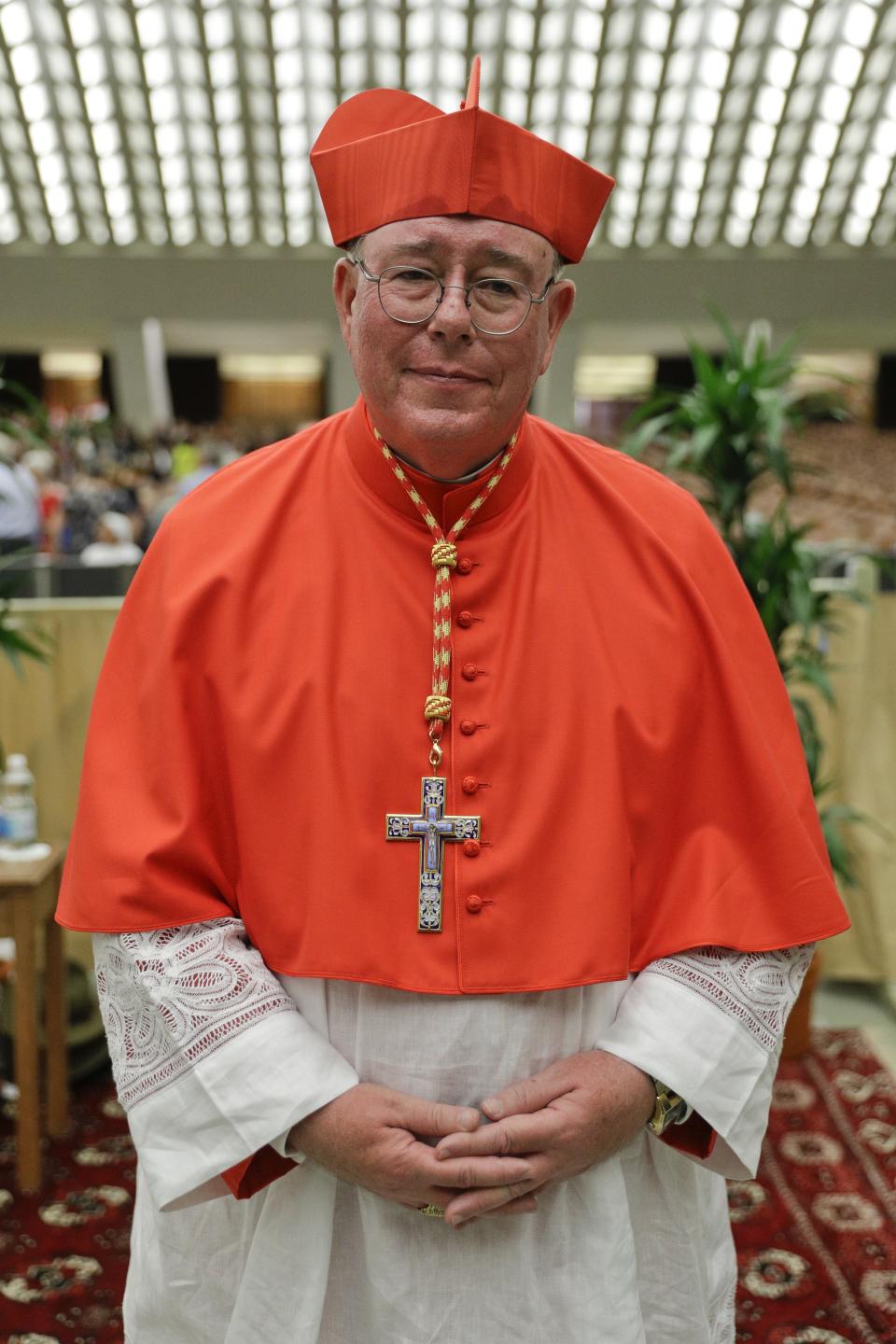 Cardinal Jean-Claude Hollerich poses for photographers prior to meeting relatives and friends after he was elevated to cardinal by Pope Francis, at the Vatican, Saturday, Oct. 5, 2019. Pope Francis has chosen 13 men he admires and whose sympathies align with his to become the Catholic Church's newest cardinals. (AP Photo/Andrew Medichini)