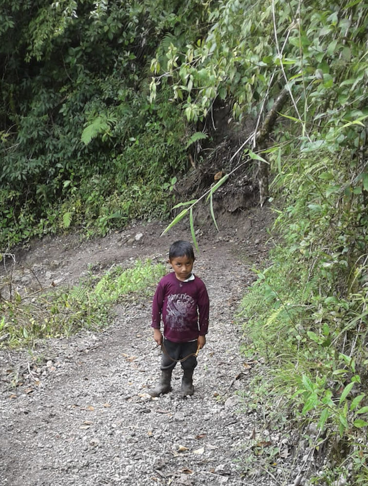 CORRECTS AGE AND SIBLING RELATIONSHIP - This undated photo provided by Catarina Gomez on Thursday, Dec. 27, 2018, shows her stepbrother Felipe Gomez Alonzo, 7, near Laguna Brava in Yalambojoch, Guatemala. Felipe died in U.S. custody at a New Mexico hospital on Christmas Eve after suffering a cough, vomiting and fever, authorities said. He was 8-years-old. The cause is under investigation. (Catarina Gomez via AP)