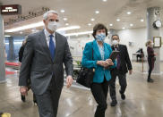 Sen. Rob Portman, R-Ohio, left, and Sen. Susan Collins, R-Maine, arrive for votes on President Joe Biden's cabinet nominees, at the Capitol in Washington, Thursday, Feb. 25, 2021. (AP Photo/J. Scott Applewhite)