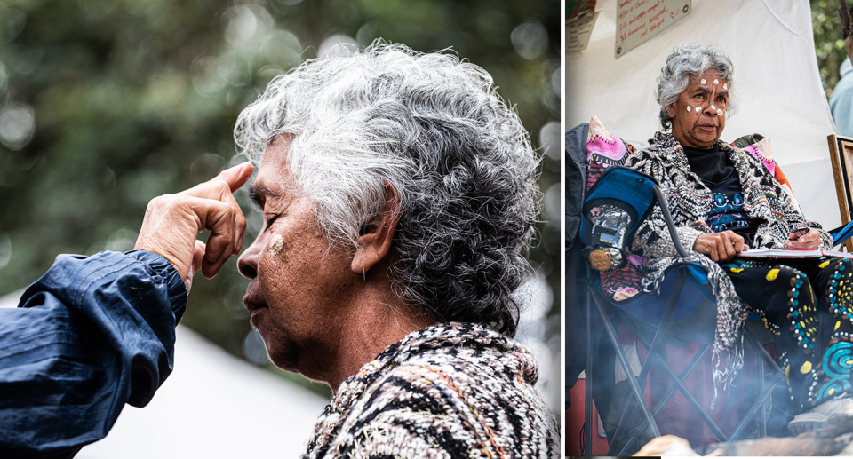 Aunty Alison in both images. Left - having traditional paint on her face. Right - sitting down. Her face is painted.