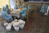 Indian health workers organize the samples at a COVID-19 testing center in New Delhi, India, Monday, April 27, 2020. India’s main medical research organization has cancelled orders to procure rapid antibody test kits from two Chinese companies after quality issues and controversies over its price. (AP Photo/Manish Swarup)