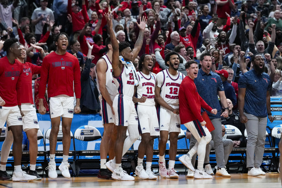 The Florida Atlantic bench celebrates in the second half of a second-round college basketball game against Fairleigh Dickinson in the men's NCAA Tournament in Columbus, Ohio, Sunday, March 19, 2023. Florida Atlantic defeated Fairleigh Dickinson 78-70. (AP Photo/Michael Conroy)