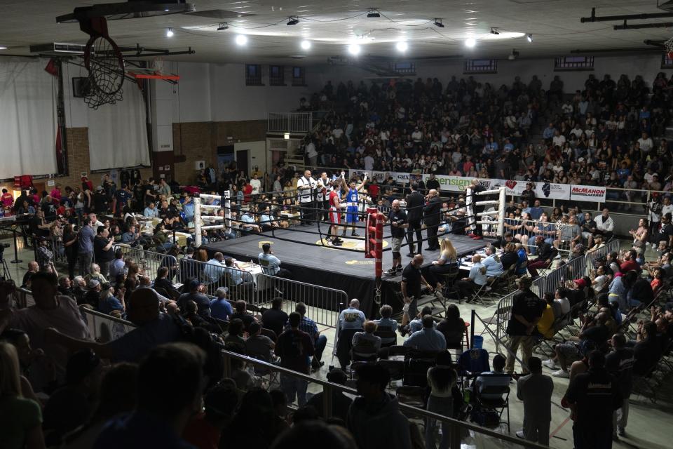 Cicero Stadium is packed with people on the final night of the 100th year of the Chicago Golden Gloves boxing tournament Sunday, April 16, 2023, in Cicero, Ill. The event was the first of its kind and spawned similar tournaments across the country. (AP Photo/Erin Hooley)