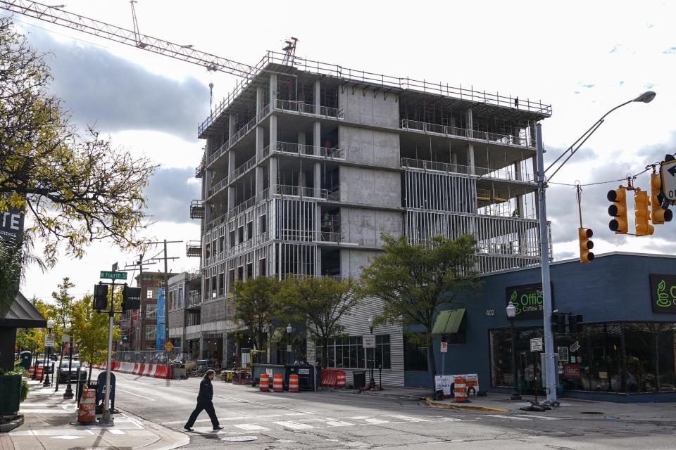 Construction crews work on a new Baker College building along South Lafayette Avenue in downtown Royal Oak in November.