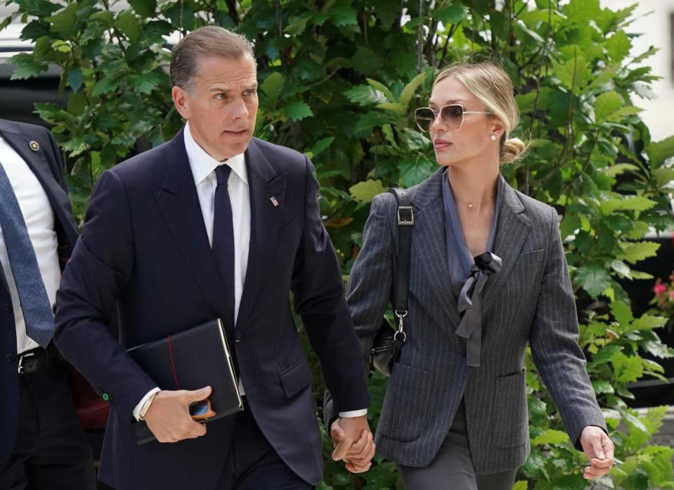 Hunter Biden, son of U.S. President Joe Biden, arrives at the federal courthouse with his wife Melissa Cohen Biden on the first day of his firearms-related criminal trial in Wilmington, Delaware, United States, on June 3, 2024.