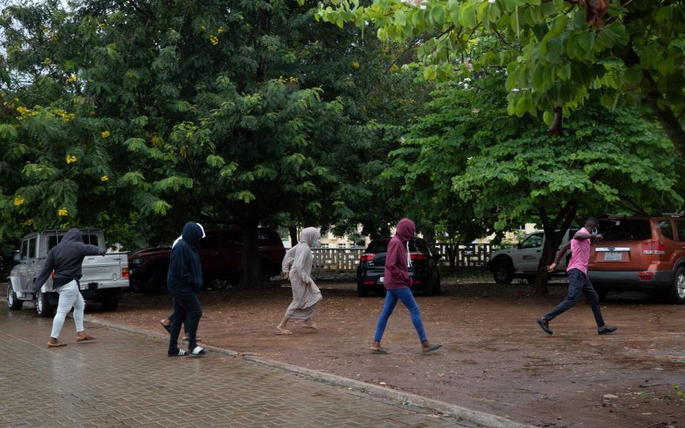 Some of the 21 people arrested leave after appearing in the Circuit Court in Ho, Ghana, on June 4, 202 - NIPAH DENNIS/AFP