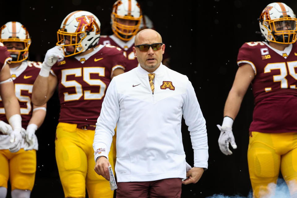 Nov. 12, 2022; Minneapolis; Minnesota Golden Gophers head coach P.J. Fleck leads his team out onto the field before the game against the <a class="link " href="https://sports.yahoo.com/ncaaw/teams/northwestern/" data-i13n="sec:content-canvas;subsec:anchor_text;elm:context_link" data-ylk="slk:Northwestern Wildcats;sec:content-canvas;subsec:anchor_text;elm:context_link;itc:0">Northwestern Wildcats</a> at Huntington Bank Stadium. Matt Krohn-USA TODAY Sports