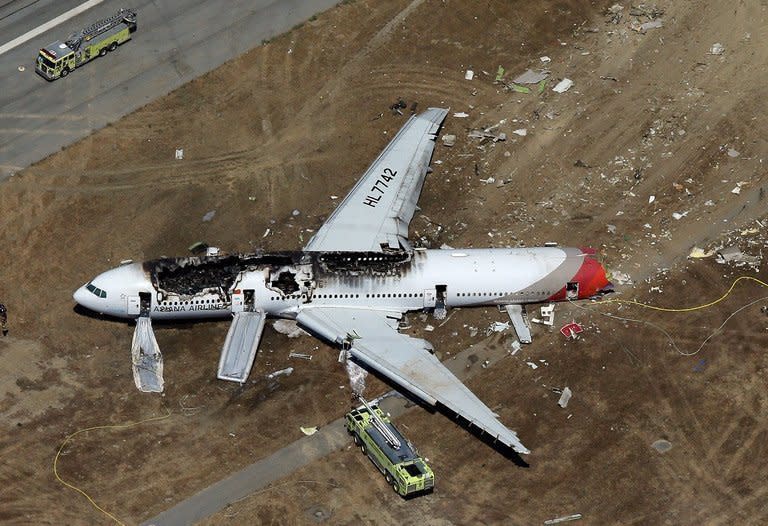 An Asiana Airlines Boeing 777 passenger jet crashed and burst into flames as it landed short of the runway at San Francisco International Airport, killing two people and injuring 182 others