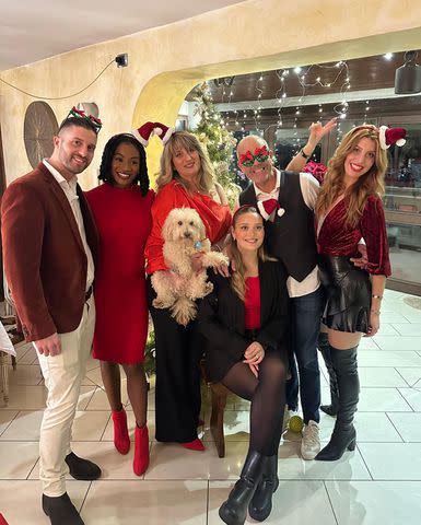 <p>Marlena Wesh/ Instagram</p> Marlena Wesh and Tommaso Martelli pose with loved ones for a festive holiday photo