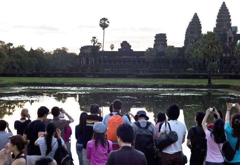 Tourists visit Cambodia's Angkor Wat temple last year. The number of international tourist arrivals grew by 4.0 percent to 1.035 billion in 2012, up from 996 million in 2011, the Madrid-based United Nations World Tourism Organisation said in an annual survey