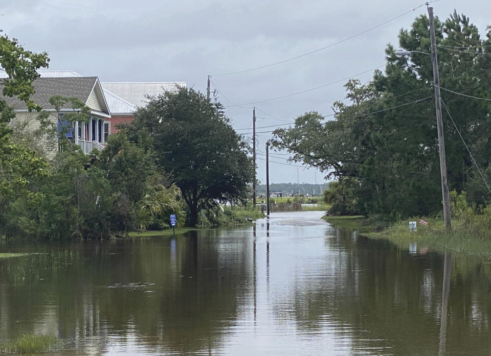 Clark Street in Pass Christian, Miss. is completely flooded after the torrential downpour from Hurricane Ida on Monday, Aug. 30, 2021. (Hunter Dawkins/The Gazebo Gazette via AP)