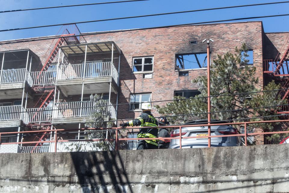 Firefighters work at the scene of an overnight fire at 671 Bronx River Rd. In Yonkers March 8, 2023. One resident was killed in the fire and at least 60 families were displaced.