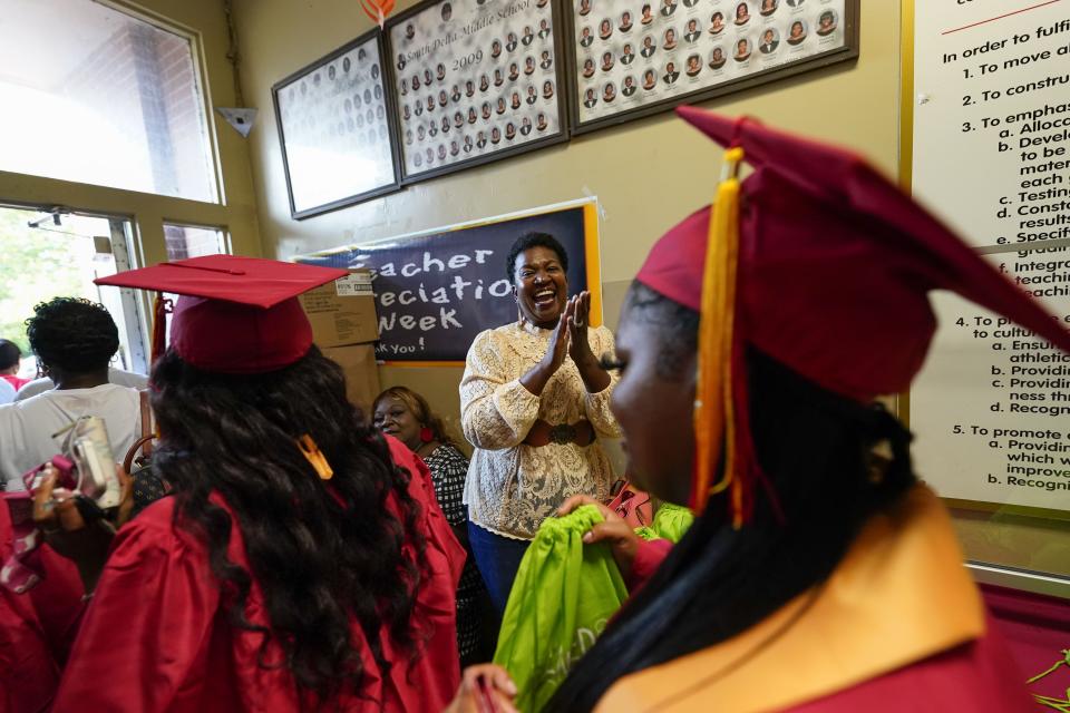 Family and friends applaud at the conclusion of graduation ceremonies for South Delta High School, in Anguilla, Miss., Friday, May 19, 2023. Many students living in Rolling Fork had their homes destroyed in a recent tornado. (AP Photo/Gerald Herbert)