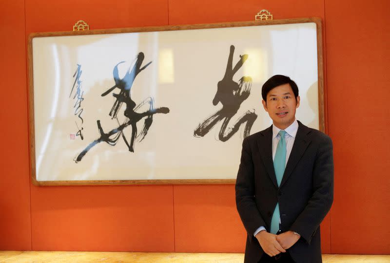 FILE PHOTO: Fred Hu, Chairman of Primavera Capital Group, poses for a photo in Beijing