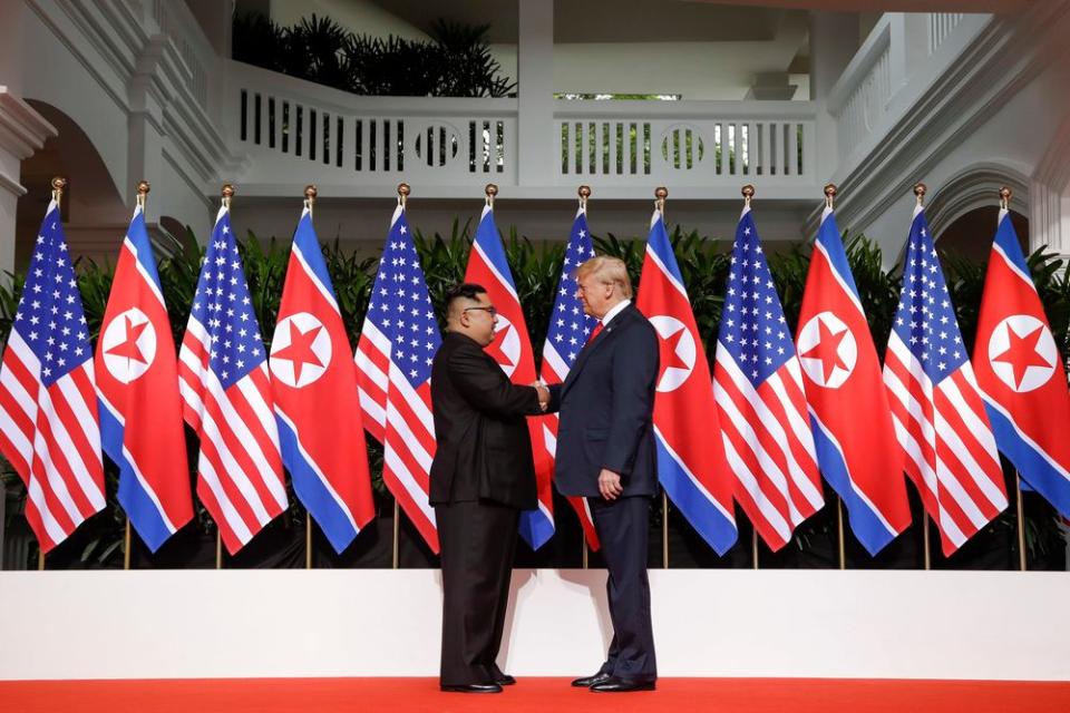 President Trump and North Korea's Kim Jong Un shake hands at their historic summit in Singapore on June 12, 2018.