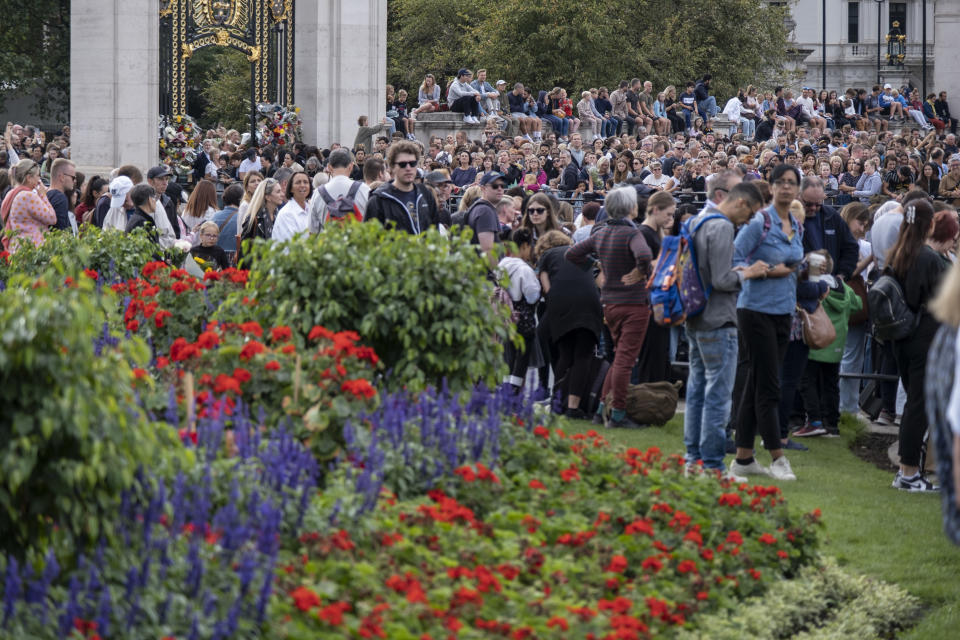 Members of the public gather in their thousands at Buckingham Palace to lay flowers and experience the atmosphere of history in the making following the death of Queen Elizabeth II, and the proclamation of the new King Charles III on 10th September 2022 in London, United Kingdom. The Queen, who was 96 reigned as monarch of the UK and Commonwealth for 70 years. (photo by Mike Kemp/In Pictures via Getty Images)