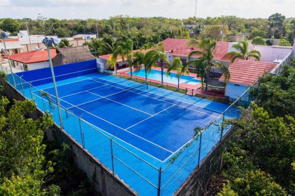 a swimming pool with a blue roof