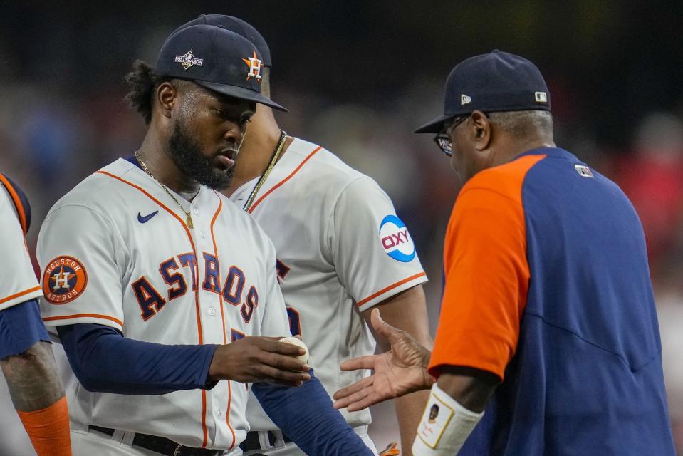 Houston Astros manager Dusty Baker takes starting pitcher Cristian Javier out of the game during the first inning of Game 7 of the baseball AL Championship Series against the Texas Rangers Monday, Oct. 23, 2023, in Houston. (AP Photo/Godofredo A. Vásquez)