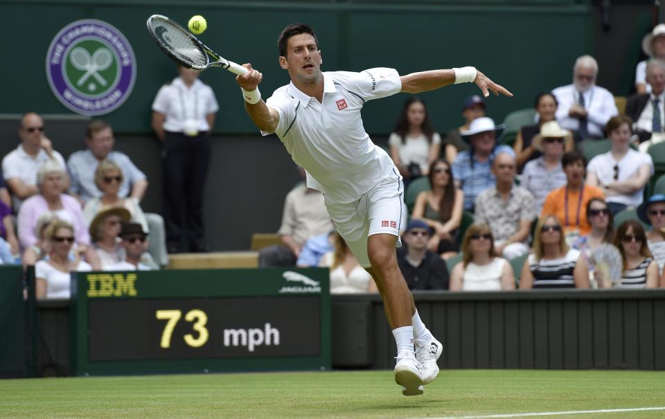 Novak Djokovic of Serbia hits a shot during his match against Jarkko Nieminen of Finland at the Wimbledon Tennis Championships in London, July 1, 2015. REUTERS/Toby Melville