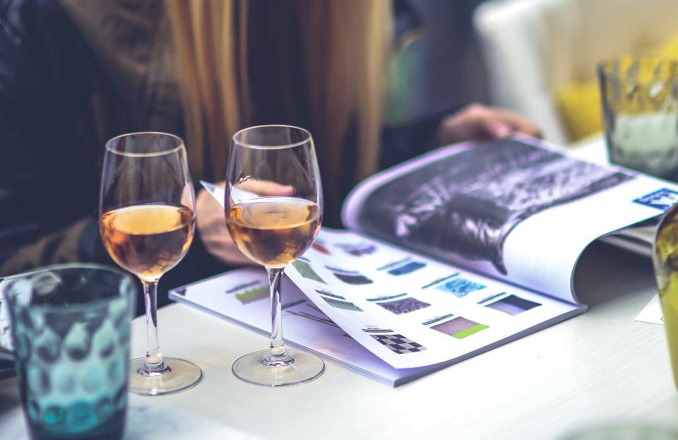 Woman with wine and magazine