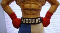 The name of local boxing icon Manny Pacquiao is pictured on a life-size 70-kg chocolate cake which is displayed to the media at a restaurant in Manila, Philippines May 2, 2015. From air-conditioned corporate boardrooms to steamy public gymnasiums, Filipinos are counting down the hours to local boxing icon Pacquiao's fight with undefeated American Floyd Mayweather Jr. in Las Vegas. The world welterweight championship bout, which is being called the "fight of the century," will bring the country to a standstill on Sunday and mark a rare period of unity for the poor Southeast Asian nation. The Pacquiao cake, which took two weeks to make, went on display on Saturday in Manila and slices will be given away after the bout. REUTERS/Erik De Castro