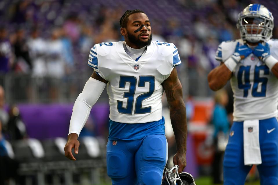 Lions running back D'Andre Swift (32) walks on the field before a game against the Vikings, Sunday, Sept. 25, 2022, in Minneapolis.