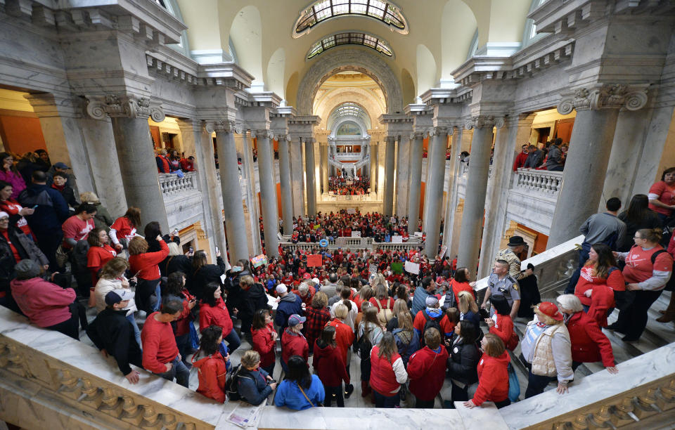 <p>Teachers from across Kentucky fill the state Capitol to rally for increased funding and to protest changes to their state funded pension system, Monday, April 2, 2018, in Frankfort, Ky. (Photo: Timothy D. Easley/AP) </p>