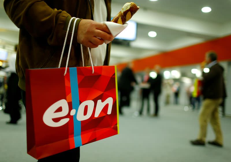 FILE PHOTO: A shareholder carries a bag with the logo of E.ON during the company's annual shareholders meeting in Essen