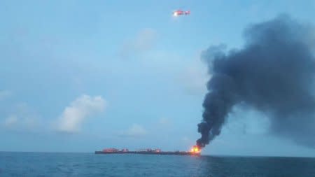 Coast Guard responds to barge on fire approximately three miles from Port Aransas jetties in Texas, U.S., October 20, 2017.    Courtesy U.S. Coast Guard/Handout via REUTERS