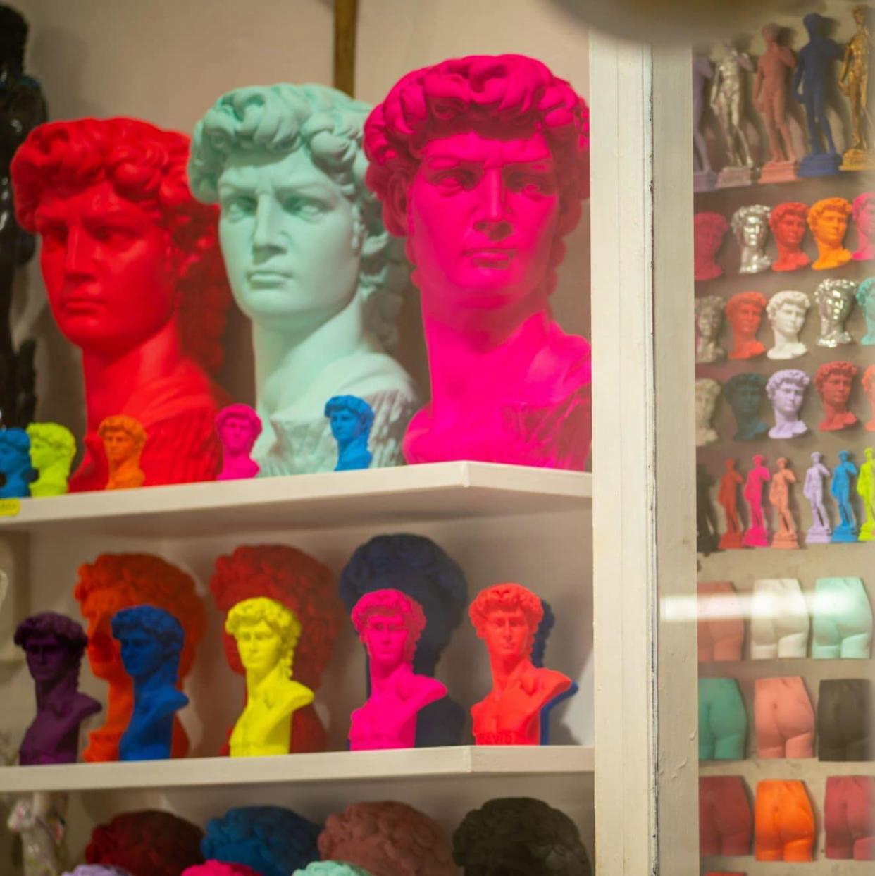 Souvenirs depicting Michelangelo's David in various bright colours